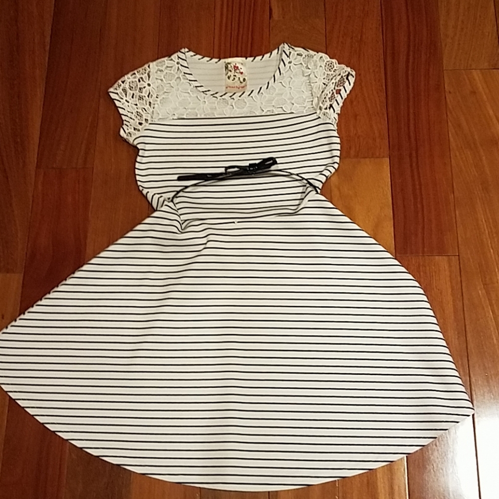 White dress with dark blue stripes.